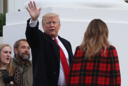 WASHINGTON, DC - NOVEMBER 19:  U.S. President Donald Trump waves as he and first lady Melania Trump welcome a North Carolina grown Fraser Fir Christmas Tree at the North Portico as it makes its way to the Blue Room for display at the White House on November 19, 2018 in Washington, DC.  (Photo by Mark Wilson/Getty Images)
