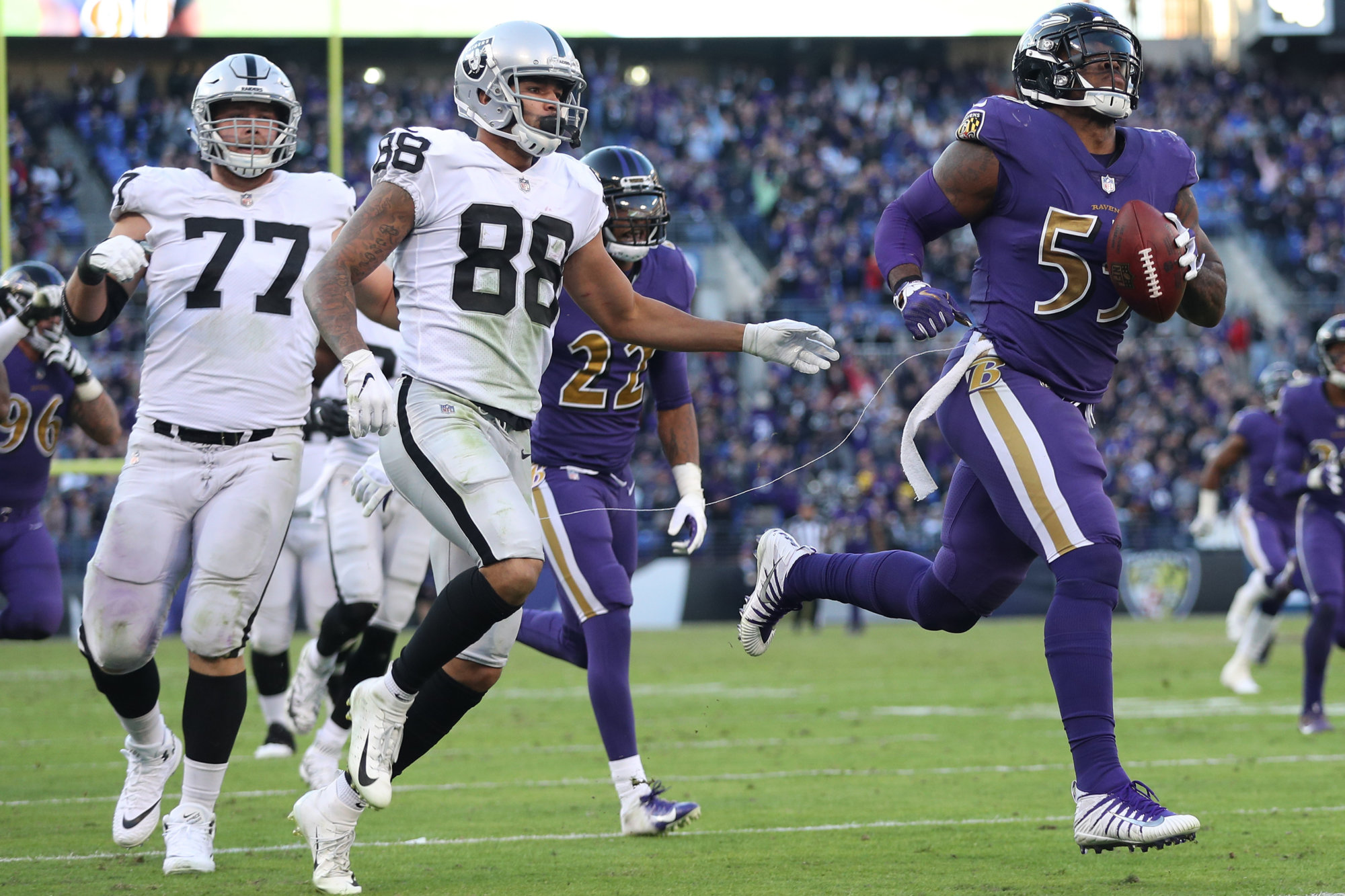 BALTIMORE, MARYLAND - NOVEMBER 25: Outside linebacker Terrell Suggs #55 of the Baltimore Ravens rushes for a touchdown after a fumble recovery against the Oakland Raiders during the fourth quarter at M&amp;T Bank Stadium on November 25, 2018 in Baltimore, Maryland. (Photo by Patrick Smith/Getty Images)