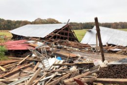 Less than a mile east of Route 301, a sturdy barn collapsed. The owner says the structure was constructed in the early 1980s and was well built. The roof was blown into an adjacent field. (WTOP/Dave Dildine)