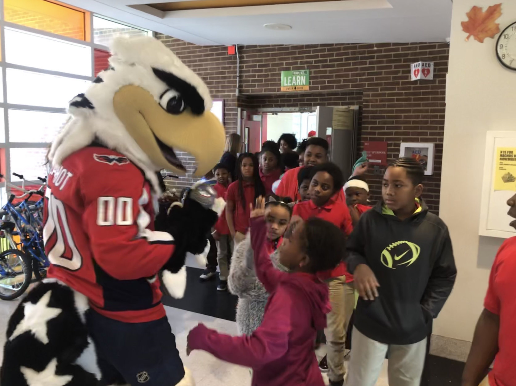 When meeting mascot Slapshot, an astounded child asked, "There's a person in there?" (WTOP/Kristi King)