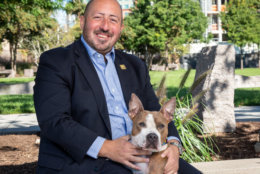 John Falcicchio, chief of staff for the mayor's office, poses with Karma, who's available for adoption at the alliance. (Courtesy Humane Rescue Alliance)