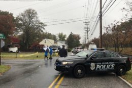 Police are still on the scene of an early-morning shooting in which an officer killed a man Monday. (WTOP/Melissa Howell)