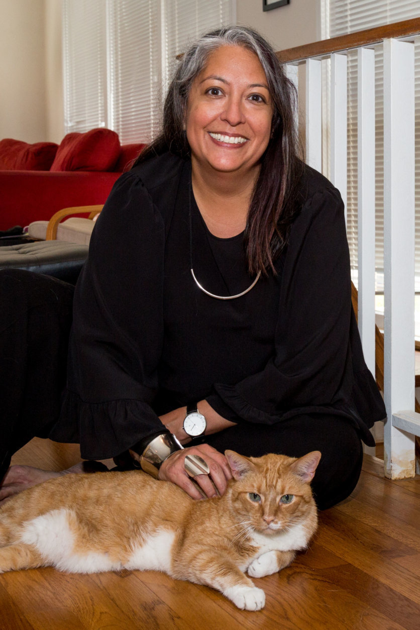 Michelle Garcia, the director of the Office of Victim Services and Justice Grants, gives her cat Cooper some scritches. (Courtesy Humane Rescue Alliance)