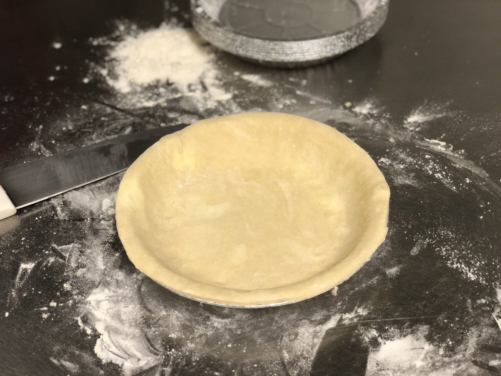 This year, skip the store-bought shells. Lauren Parlato, head baker at D.C.’s Little Red Fox, shares her recipe — and tips — for making a simple pie crust at home. (WTOP/Rachel Nania) 