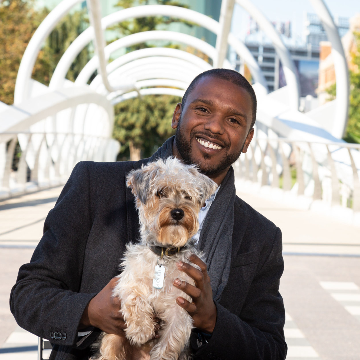 Victor Jimenez, public information officer for the Mayor’s Office of Community Affairs, hits the town with his dog Teddy. (Courtesy Humane Rescue Alliance)