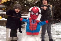 A couple of local kids pay tribute to the late, great Stan Lee as wintry weather hits the D.C. area. (Courtesy Larry Graham)
