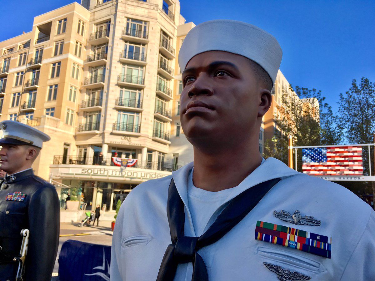 Sculptures representing the five branches of the U.S. Military are unveiled at National Harbor. (WTOP/Liz Anderson)