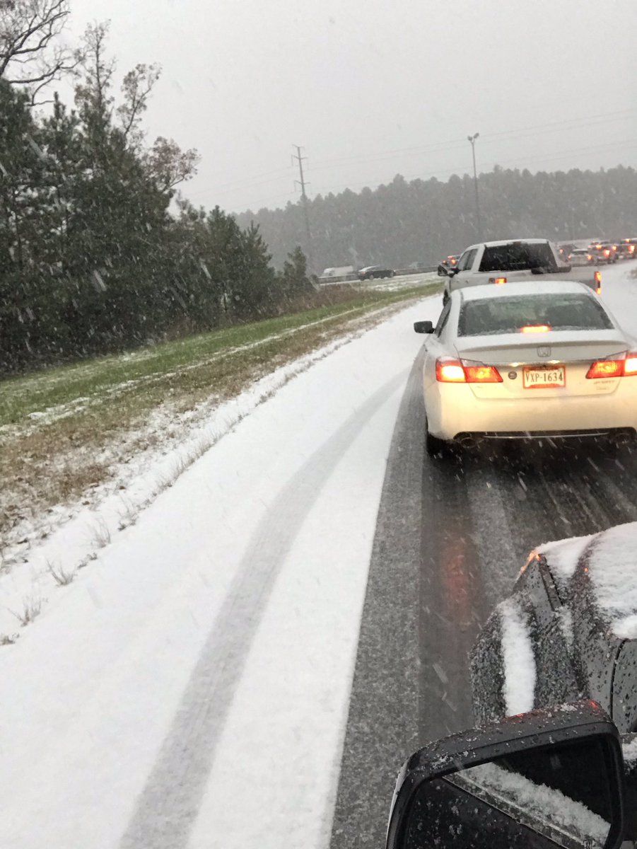 Traffic builds as snow falls while drivers merge onto 28 in Virginia. (Courtesy @LeslieOThomas via Twitter)