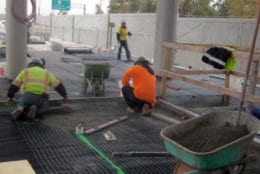 Workers doing paver placement at the Ashburn station. (Courtesy Metropolitan Washington Airports Authority)