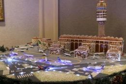 The gingerbread airport weighs 500 pounds and contains 100 LED lights, 30 feet of electrical wire, 306 pieces of gingerbread and 30 pounds of fondant runways.(Courtesy Willard InterContinental)
