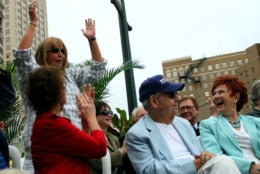 Penny Marshall, standing left, acknowledges the crowd as Erin Moran, left, Cindy Williams, third left, Tom Bosley and Marion Ross, right, attend an unveiling of a bronze statue of the "Happy Days" character Arthur Fonzarelli, also known as "The Fonz," Aug. 19, 2008, in Milwaukee, Wis. The program, which ran from 1974-1984, was based in Milwaukee. (AP Photo/Carrie Antlfinger)