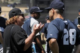 New York Yankees manager Joe Girardi, right, talks with actress Penny Marshall prior to their baseball game against the Los Angeles Dodgers, Saturday, June 26, 2010, in Los Angeles. (AP Photo/Mark J. Terrill)