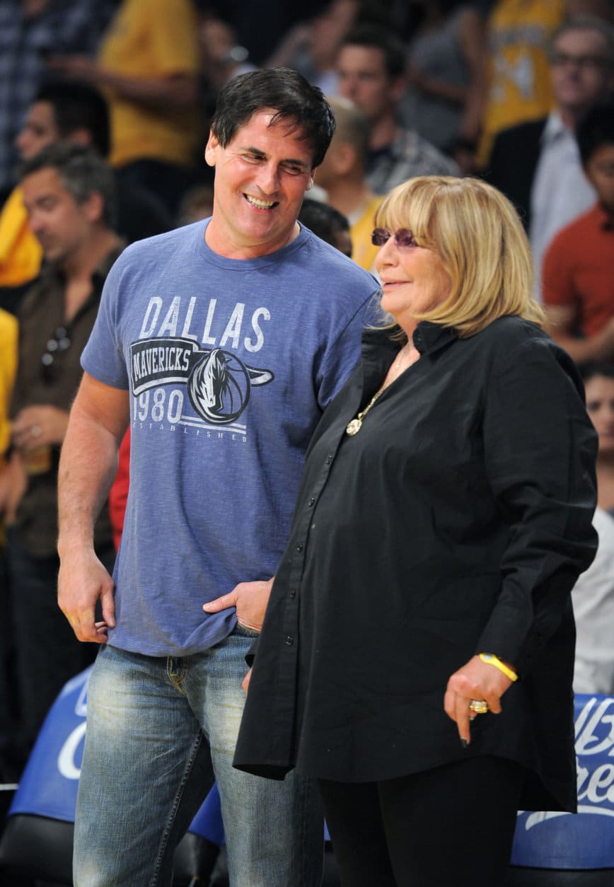Dallas Mavericks owner Mark Cuban talks with actress Penny Marshall prior to Game 1 of a second-round NBA playoff basketball series against the Los Angeles Lakers, Monday, May 2, 2011, in Los Angeles. The Mavericks won 96-94.  (AP Photo/Mark J. Terrill)