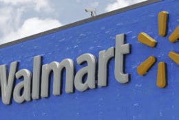 FILE - This Thursday, June 1, 2017, file photo, shows a Walmart sign at one of their stores. A 20-year-old man in southern Oregon filed a lawsuit, Monday, March 5, 2018, against Dick’s Sporting Goods and Walmart after he says they refused to sell him a rifle. (AP Photo/Alan Diaz, File)