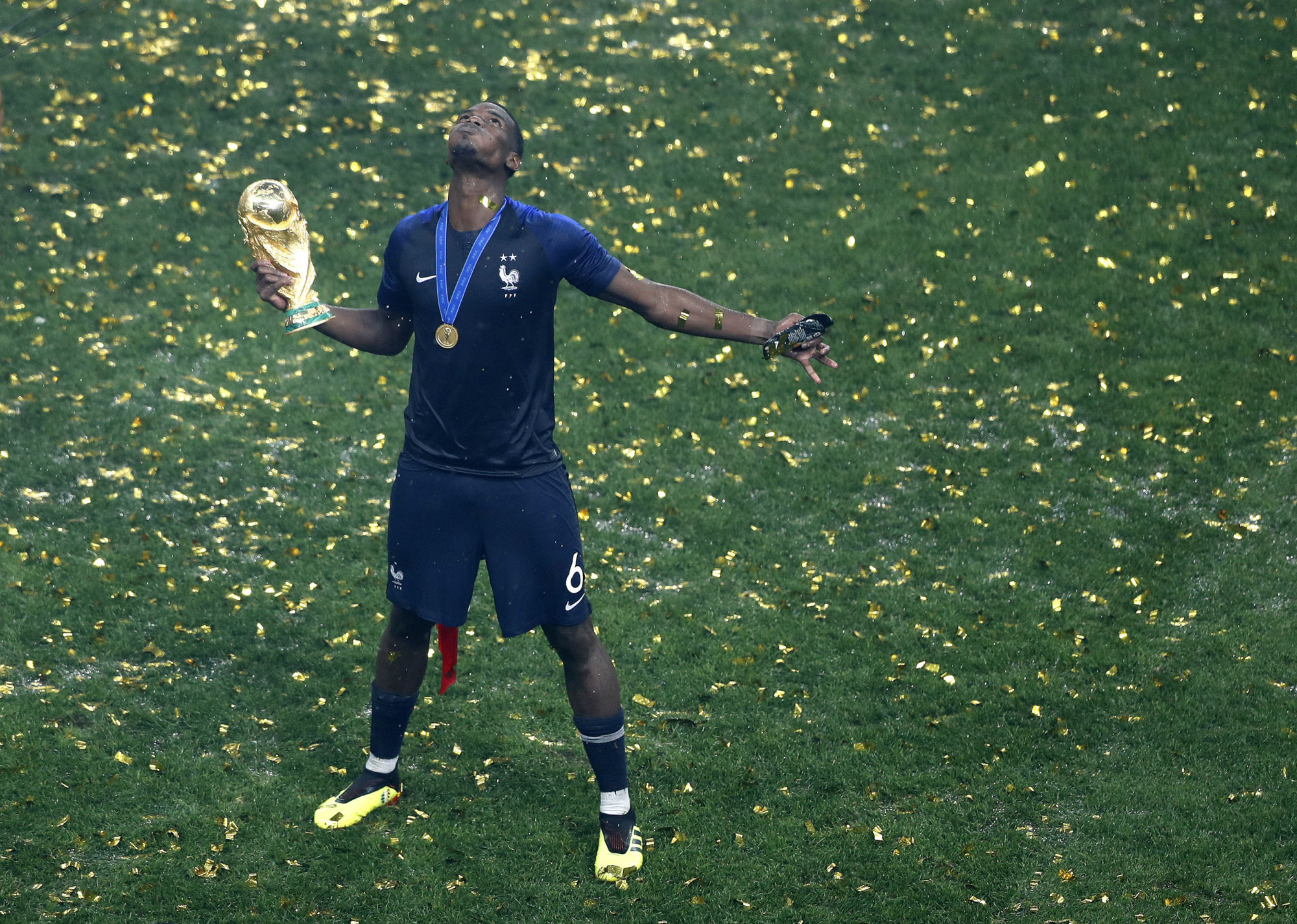 France's Paul Pogba celebrates with the trophy after winning the final match between France and Croatia at the 2018 soccer World Cup in the Luzhniki Stadium in Moscow, Russia, Sunday, July 15, 2018. (AP Photo/Frank Augstein)