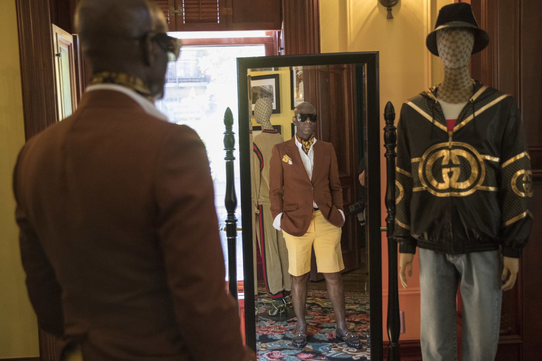In this Thursday, July 19, 2018 photo, designer Dapper Dan is seen at his atelier in the Harlem neighborhood of New York. Harlem designer Dapper Dan spent years in the 1980s with a client list that included the who's who of hip-hop before legal issues over the clothes he was making got in the way. Now the fashion groundbreaker is back after more than two decades out of the public eye. He's got a partnership with Gucci and the likes of superstar entertainer Beyonce among those wearing his designs. (AP Photo/Mary Altaffer)