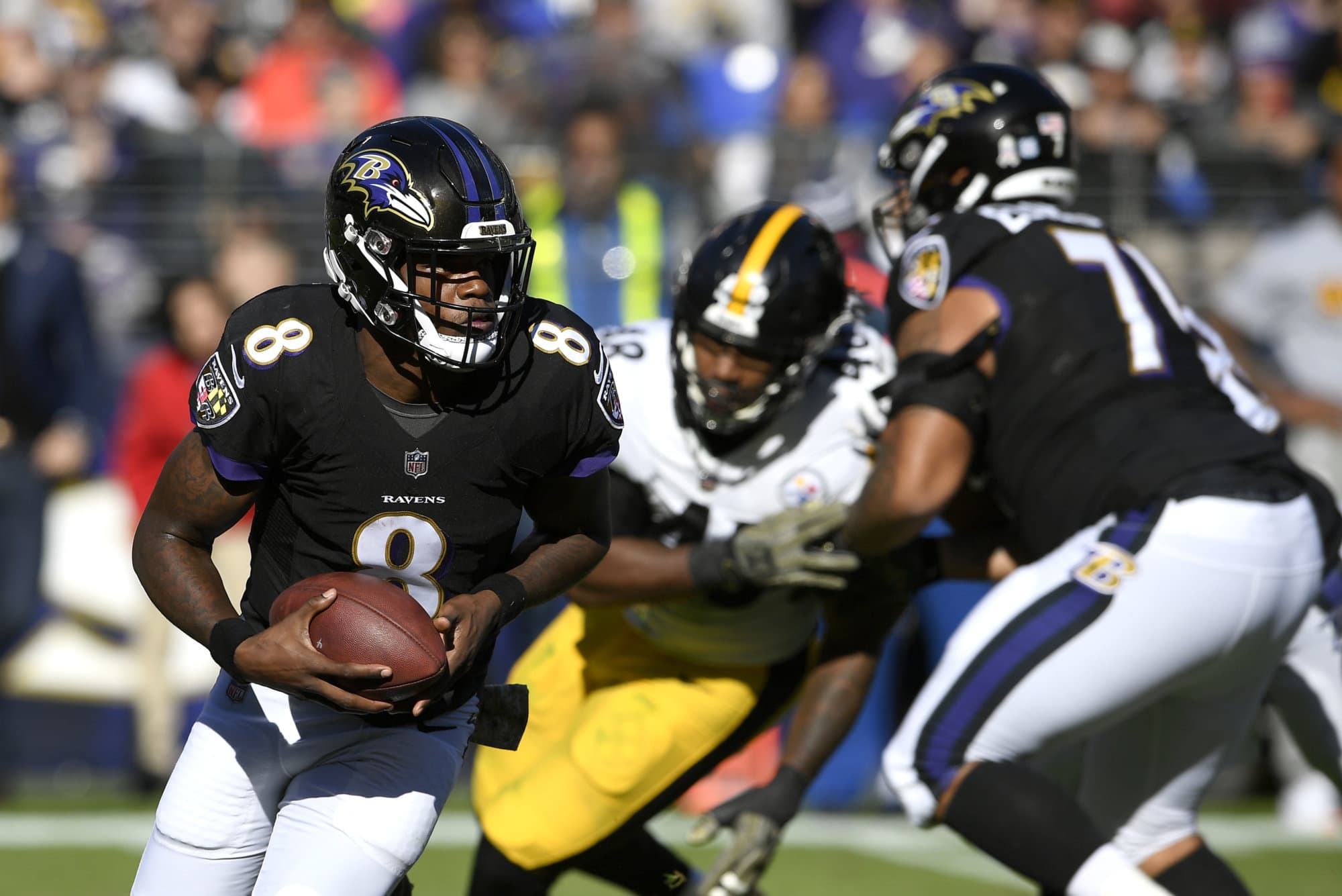 FILE - In this Nov. 4, 2018, file photo ,Baltimore Ravens quarterback Lamar Jackson (8) rushes the ball in the first half of an NFL football game against the Pittsburgh Steelers in Baltimore. Joe Flacco's hip injury means extra practice time for Ravens backup quarterbacks Lamar Jackson and Robert Griffin III, and perhaps one of them will make their first start of the season.  (AP Photo/Nick Wass, File)