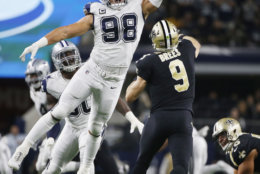 New Orleans Saints quarterback Drew Brees (9) is pressured by Dallas Cowboys defensive tackle Tyrone Crawford (98) as he passes during the second half of an NFL football game, in Arlington, Texas, Thursday, Nov. 29, 2018. (AP Photo/Ron Jenkins)