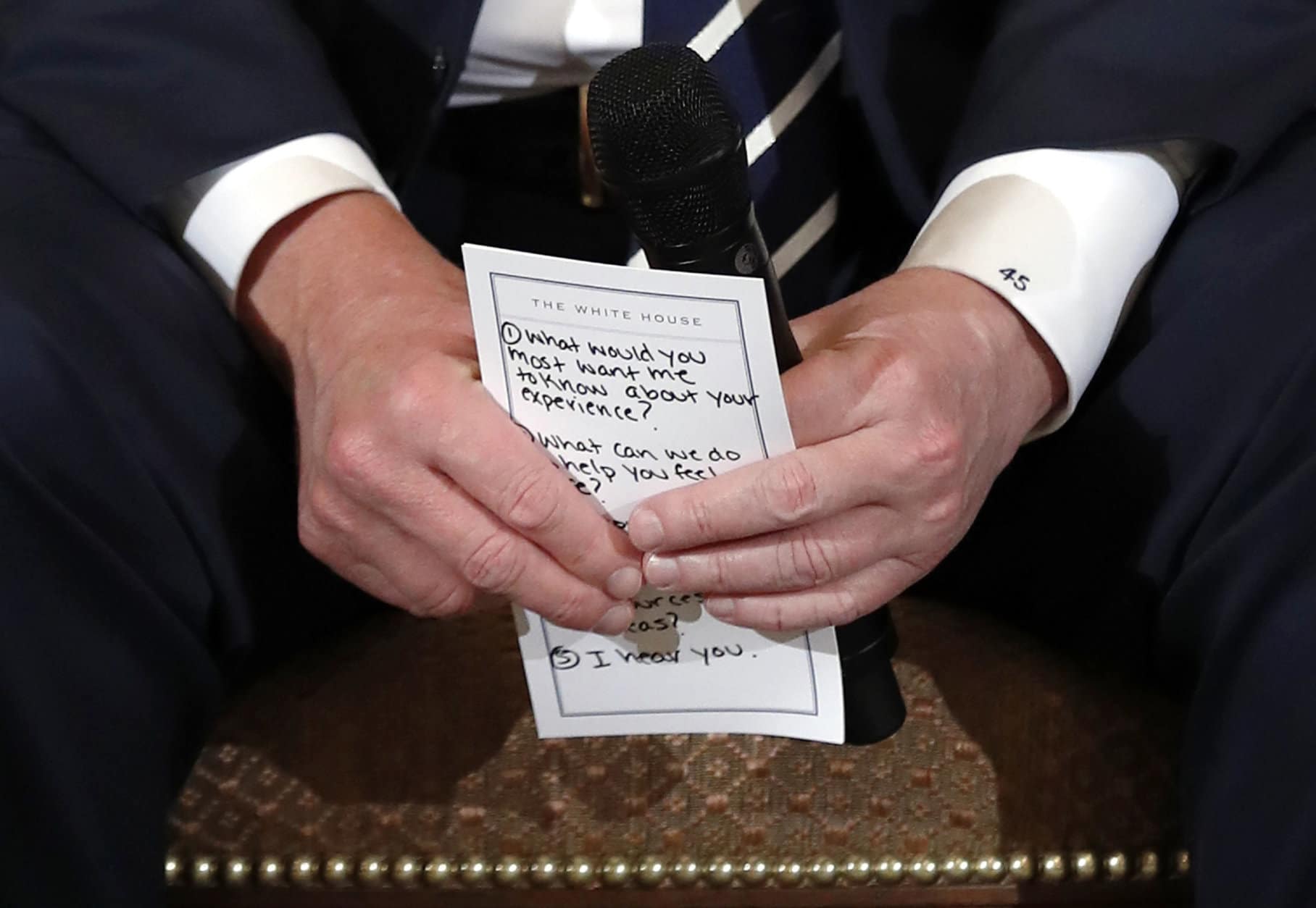 President Donald Trump holds notes during a listening session with high school students and teachers at the White House in Washington on Feb. 21, 2018. Trump heard the stories of students and parents affected by school shootings, one week after the deadly mass shooting at Marjory Stoneman Douglas High School in Florida. (AP Photo/Carolyn Kaster)