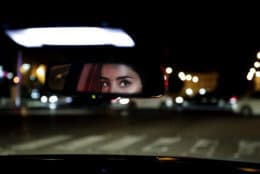 Hessah al-Ajaji drives her car down busy Tahlia Street after midnight for the first time in Saudi Arabia's capital Riyadh on June 24, 2018, just minutes after the world's last remaining ban on women driving was lifted. (AP Photo/Nariman El-Mofty)