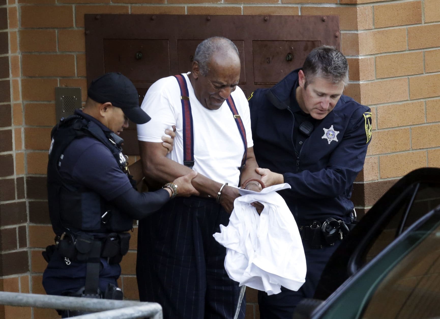 Bill Cosby is escorted out of the Montgomery County Correctional Facility in Eagleville, Pa., on Sept. 25, 2018, following his sentencing to a three-to-10-year prison sentence for sexual assault. (AP Photo/Jacqueline Larma)