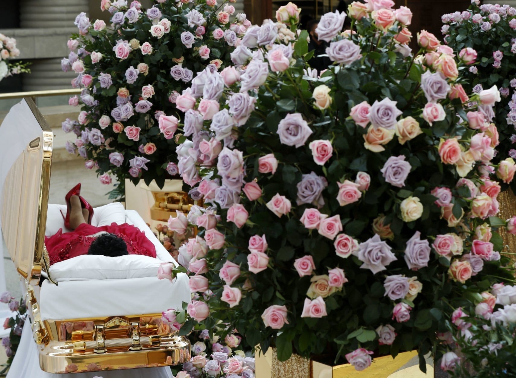 Aretha Franklin lies in her casket at the Charles H. Wright Museum of African American History in Detroit during a public visitation on Aug. 28, 2018. Franklin died on Aug. 16 of pancreatic cancer at the age of 76. (AP Photo/Paul Sancya, Pool)