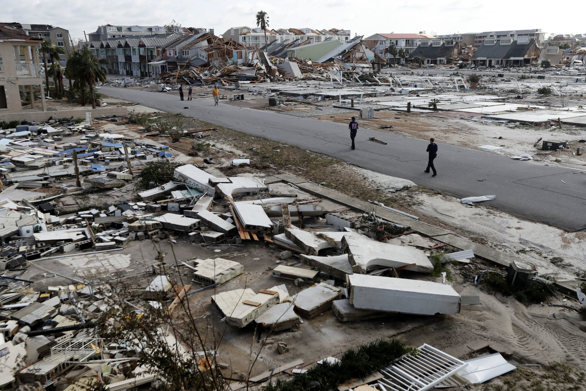 Rescue personnel search through debris in the aftermath of Hurricane Michael in Mexico Beach, Fla., on Oct. 11, 2018. (AP Photo/Gerald Herbert)