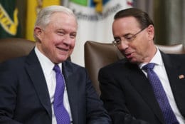 Attorney General Jeff Sessions, left, and Deputy Attorney General Rod Rosenstein, talk during an event to announce new strategic actions to combat the opioid crisis at the Department of Justice's National Opioid Summit in Washington on Oct. 25, 2018. (AP Photo/Alex Brandon)