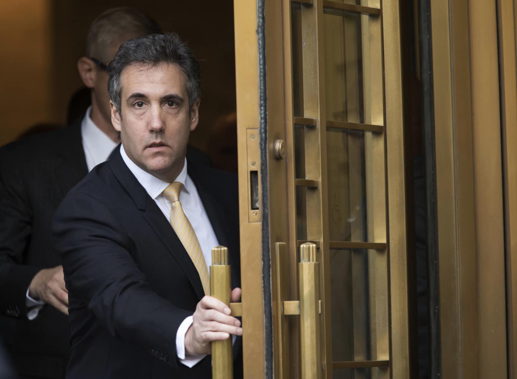 Michael Cohen leaves Federal court in New York on Aug. 21, 2018, after pleading guilty to charges including campaign finance fraud stemming from hush money payments to porn actress Stormy Daniels and ex-Playboy model Karen McDougal. (AP Photo/Mary Altaffer)