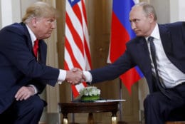 U.S. President Donald Trump, left, and Russian President Vladimir Putin shake hands at the beginning of a meeting at the Presidential Palace in Helsinki, Finland, on July 16, 2018. (AP Photo/Pablo Martinez Monsivais)
