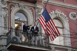 Employees at the U.S. consulate in St. Petersburg, Russia, remove the U.S flag on March 31, 2018, after Russia announced it was closing the consulate and expelling more than 150 diplomats, including 60 Americans. The move was in retaliation for the wave of Western expulsions of Russian diplomats over the poisoning of an ex-spy and his daughter in Britain. (AP Photo/Dmitri Lovetsky)