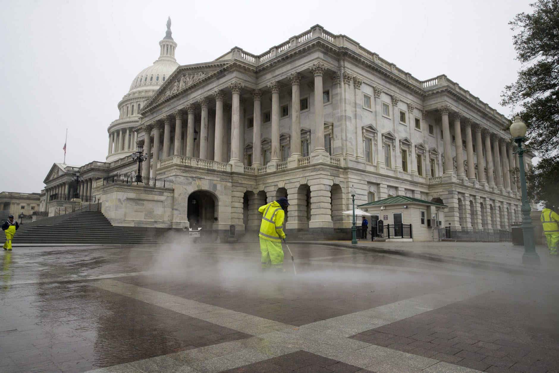 A worker power washes the plaza on the East Front of the U.S. Capitol,  Sunday, Dec. 2, 2018, in Washington in preparation of President George H.W. Bush lying in state. Bush, who died late Friday at his Houston home at age 94, is to be honored with a state funeral at National Cathedral in the nation's capital on Wednesday, followed by burial Thursday on the grounds of his presidential library at Texas A&amp;M.  Before that, his body will lie in state in the Capitol Rotunda for a public viewing from his arrival in Washington on Monday until Wednesday morning.  (AP Photo/Alex Brandon)