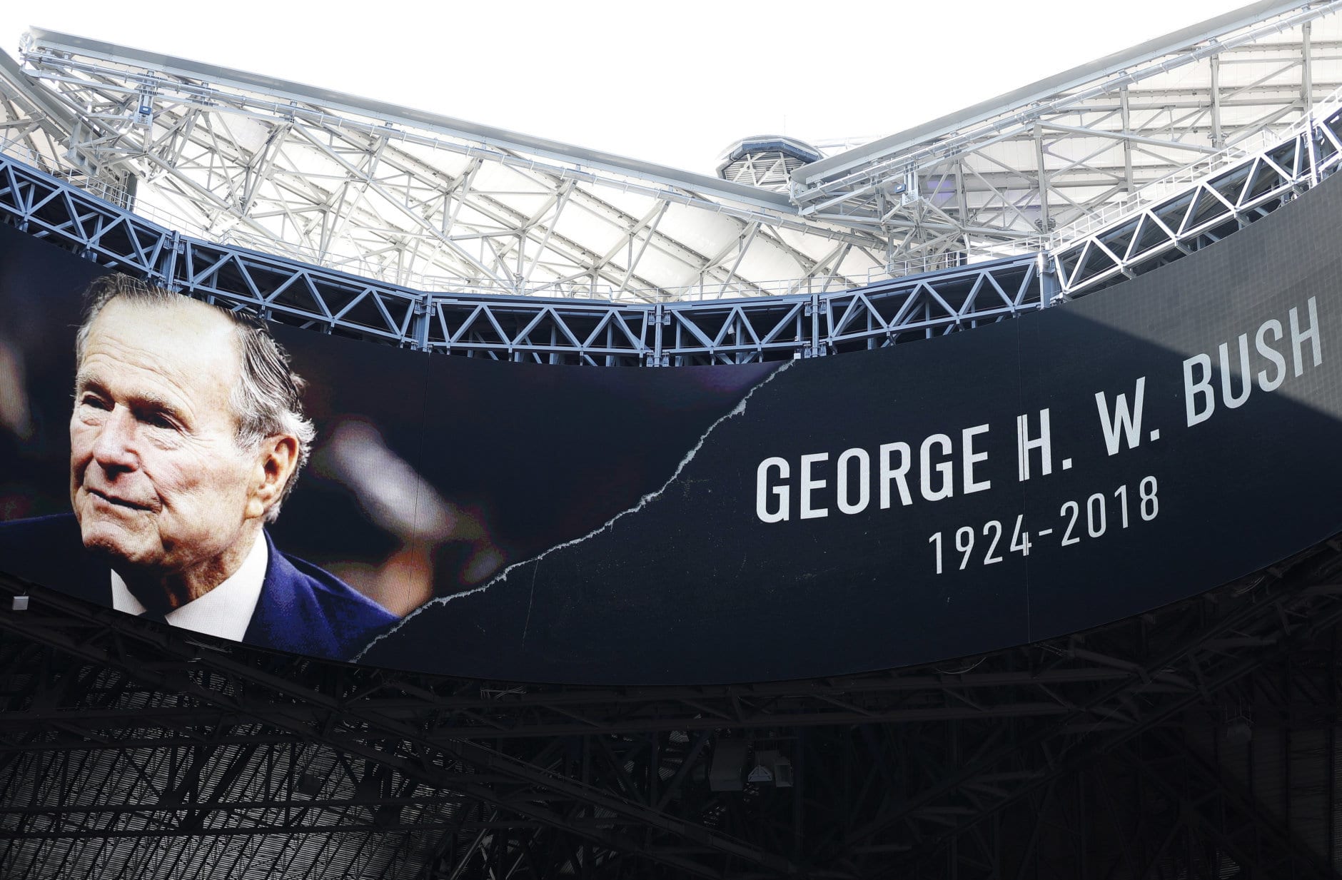 A tribute for Former President George H.W. Bush is seen before the first half of an NFL football game between the Atlanta Falcons and the Baltimore Ravens, Sunday, Dec. 2, 2018, in Atlanta. Bush died late Friday at his Houston home at age 94. (AP Photo/John Bazemore)