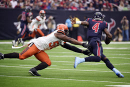 Cleveland Browns defensive end Chris Smith (50) pressures Houston Texans quarterback Deshaun Watson (4) during the first half of an NFL football game, Sunday, Dec. 2, 2018, in Houston. (AP Photo/Eric Christian Smith)