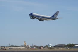 The plane carrying former President George H.W. Bush takes off from Ellington Filed Monday, Dec. 3, 2018, in Houston, as it heads to Washington. (AP Photo/David J. Phillip, Pool)