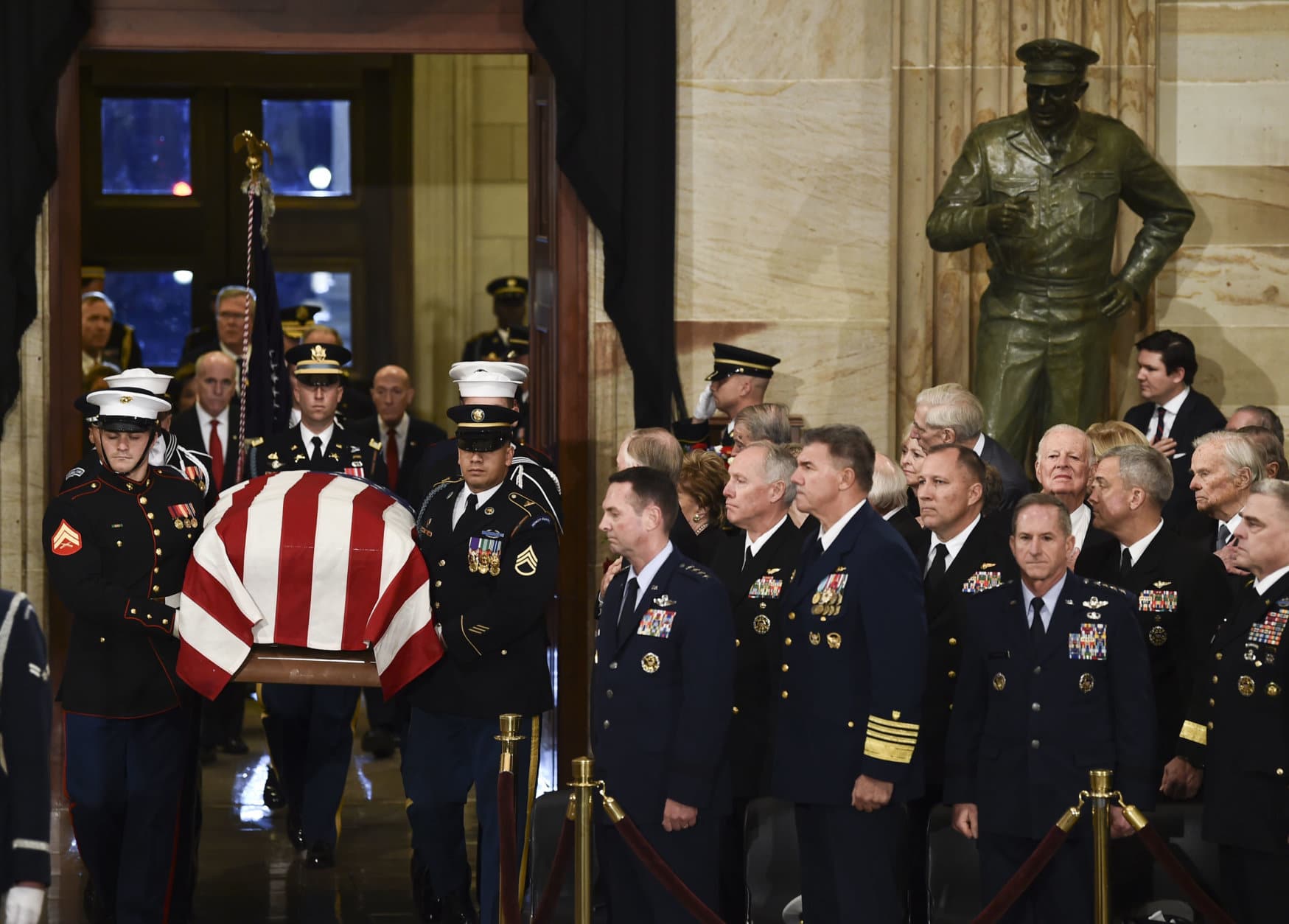 The casket bearing the remains of former President George H.W. Bush arrives at the Capitol in Washington, Monday, Dec. 3, 2018. (Brendan Smialowski/Pool Photo via AP)
