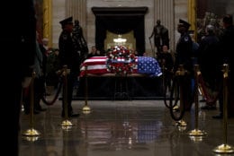 The flag-draped casket of former President George H.W. Bush lies in state in the Capitol Rotunda in Washington, Wednesday, Dec. 5, 2018. (AP Photo/Jose Luis Magana)