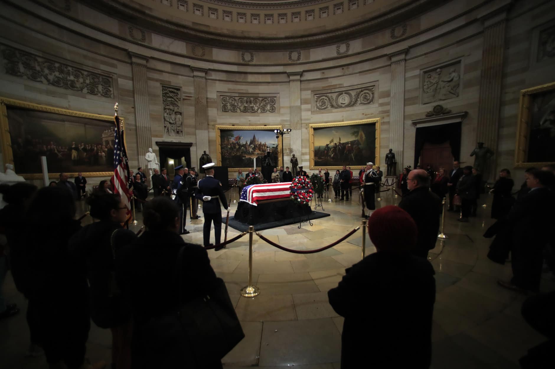 The last group of visitors pay their last respects to former President George H.W. Bush lying in state at the U.S. Capitol in Washington, Wednesday, Dec. 5, 2018. (AP Photo/Manuel Balce Ceneta)