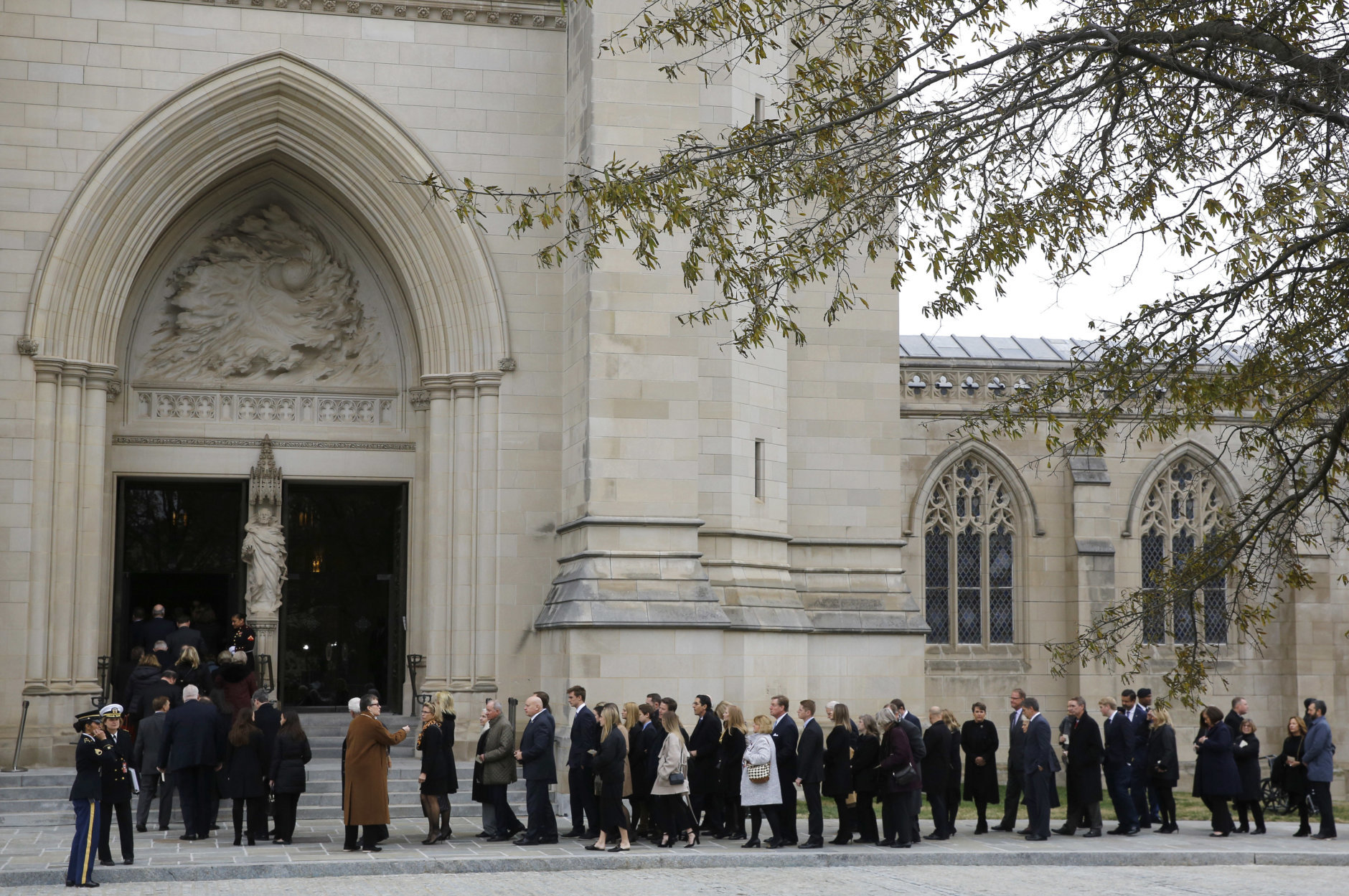 Mourners file into the Washington National Cathedral before the State Funeral for former President George H.W. Bush in Washington, Wednesday, Dec. 5, 2018. (AP Photo/Patrick Semansky)