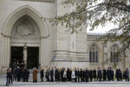 Mourners file into the Washington National Cathedral before the State Funeral for former President George H.W. Bush in Washington, Wednesday, Dec. 5, 2018. (AP Photo/Patrick Semansky)