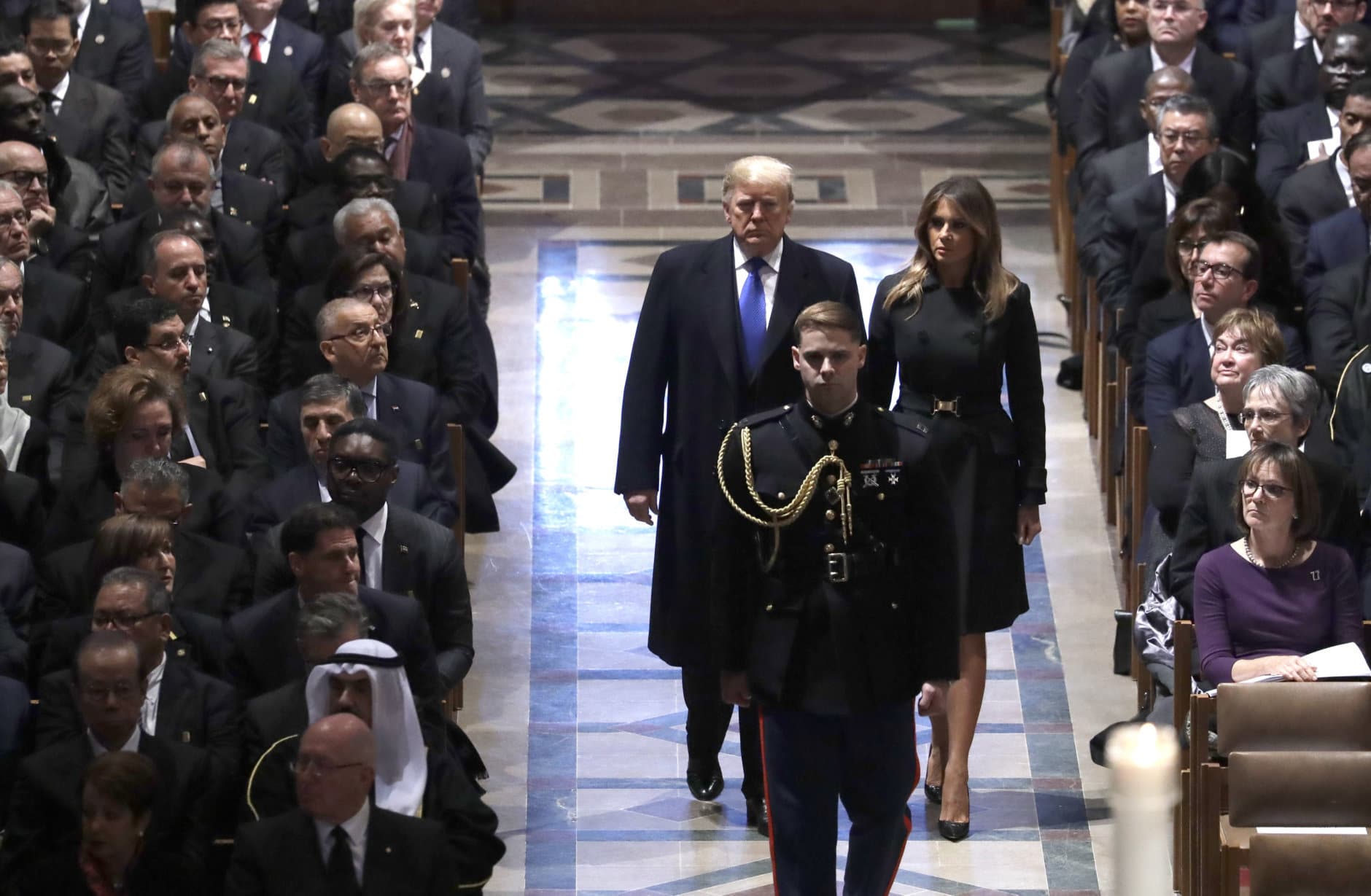 President Donald Trump and first lady Melania Trump arrive for the State Funeral former President George H.W. Bush, at the National Cathedral, Wednesday, Dec. 5, 2018, in Washington. (AP Photo/Evan Vucci)