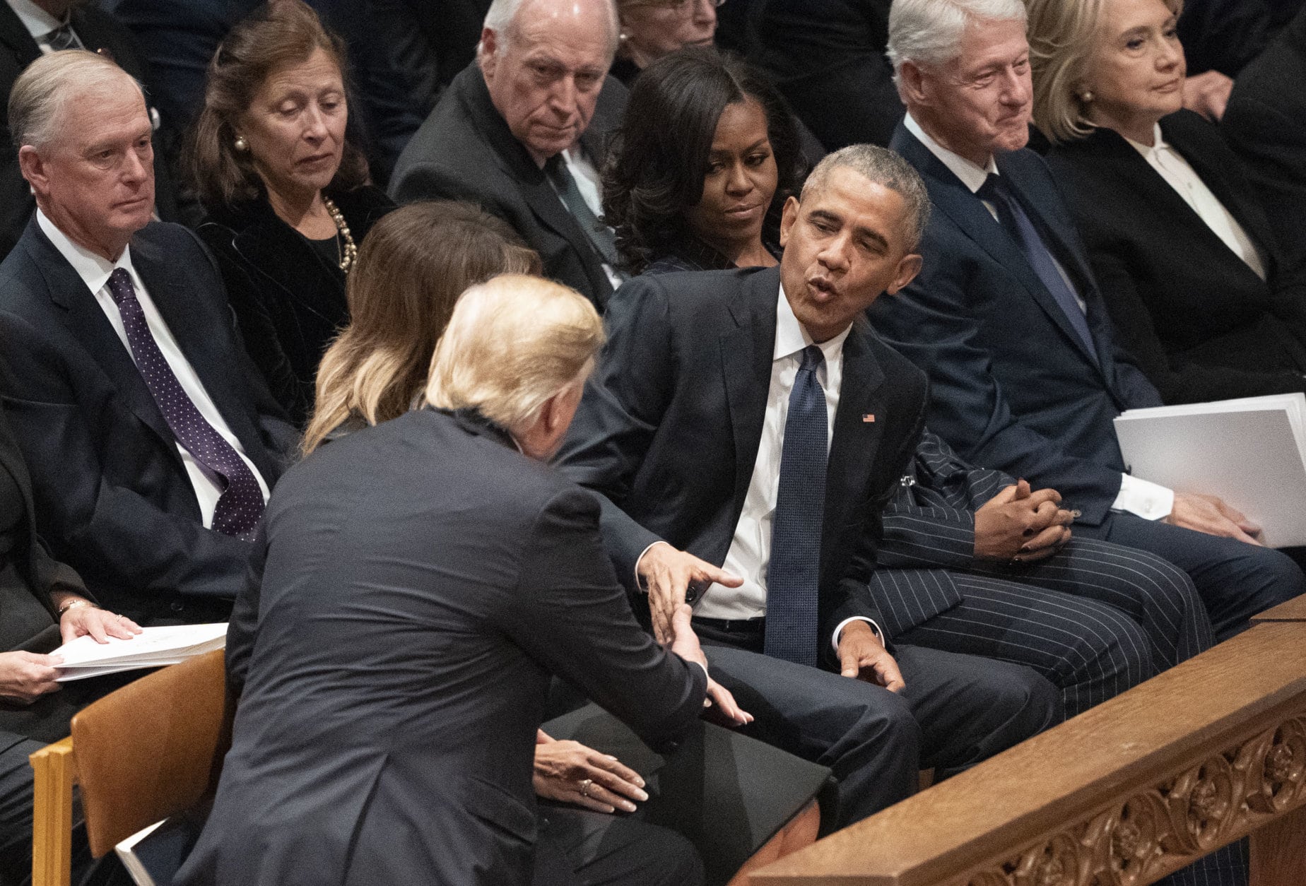 President Donald Trump shakes hands with former President Barack Obama during a State Funeral service for former President George H.W. Bush at Washington National Cathedral in Washington, Wednesday, Dec. 5, 2018. (AP Photo/Carolyn Kaster)