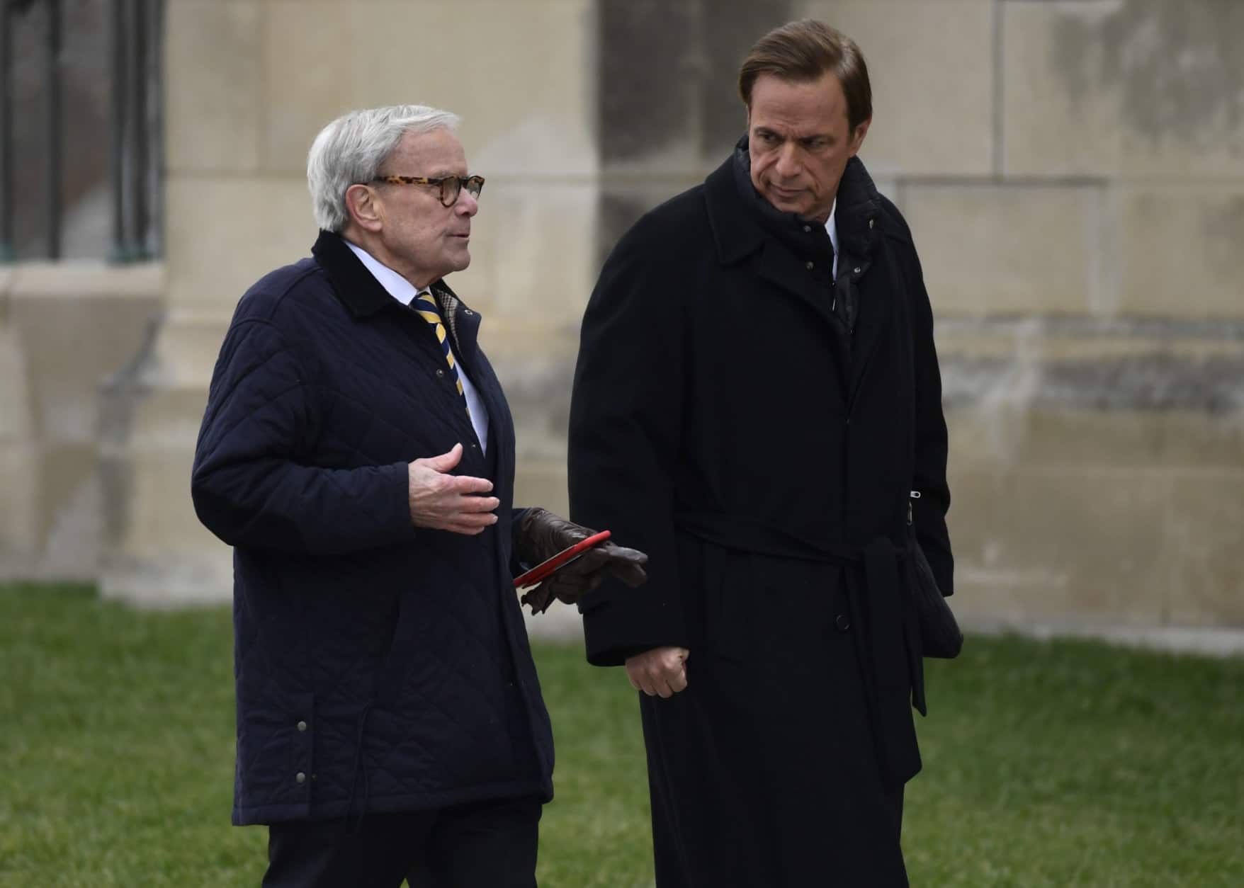 Television newsman Tom Brokaw, left, and presidential historian Michael Beschloss, right, arrive for the State Funeral of former President George H.W. Bush at the National Cathedral in Washington, Wednesday, Dec. 5, 2018. (AP Photo/Susan Walsh)