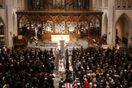 The flag-draped casket of former President George H.W. Bush is carried by a joint services military honor guard from St. Martin's Episcopal Church Thursday, Dec. 6, 2018, in Houston. (AP Photo/Mark Humphrey)