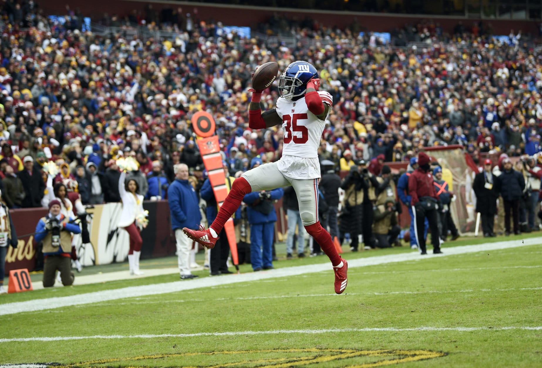 New York Giants free safety Curtis Riley returns his interception into the end zone for a touchdown during the first half of an NFL football game against the Washington Redskins, Sunday, Dec. 9, 2018, in Landover, Md. (AP Photo/Nick Wass)