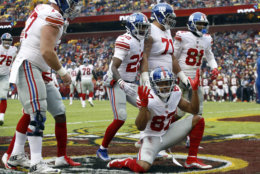 New York Giants wide receiver Sterling Shepard (87) celebrates his touchdown with teammates during the first half of an NFL football game against the Washington Redskins, Sunday, Dec. 9, 2018, in Landover, Md. (AP Photo/Patrick Semansky)