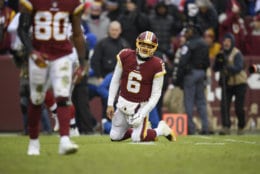 Washington Redskins quarterback Mark Sanchez (6) reacts after throwing an interception during the first half of an NFL football game against the New York Giants, Sunday, Dec. 9, 2018, in Landover, Md. (AP Photo/Nick Wass)