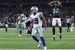 Dallas Cowboys wide receiver Amari Cooper (19) scores a 15-yard touchdown against the Philadelphia Eagles in overtime of an NFL football game, in Arlington, Texas, Sunday, Dec. 9, 2018. Dallas won 29-23. (AP Photo/Roger Steinman)
