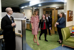 First lady Melania Trump arrives to greet children released from the neonatal intensive care unit (NICU) and their parents at Children's National Health System, Thursday, Dec. 13, 2018, in Washington. (AP Photo/Andrew Harnik)