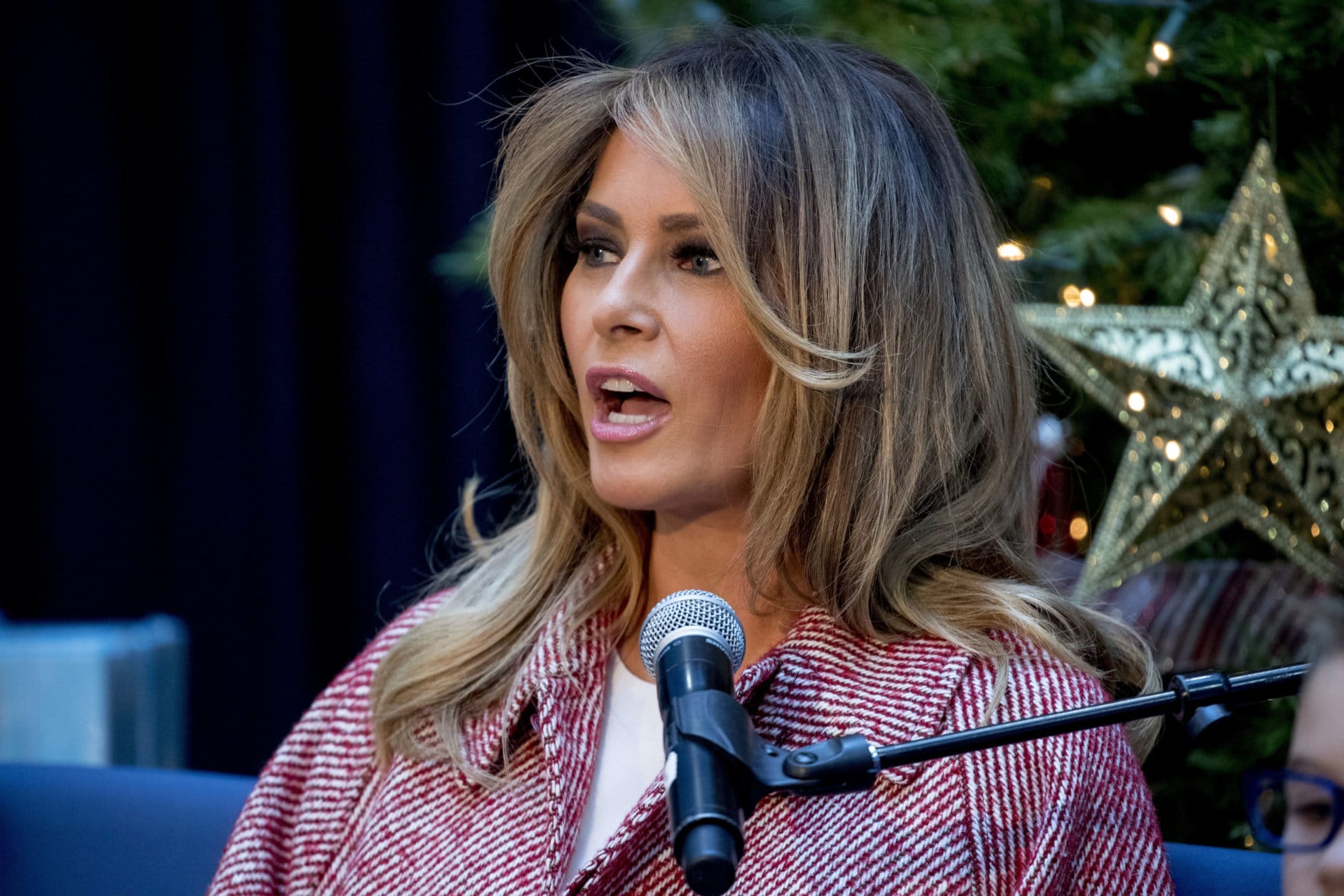 First lady Melania Trump reads "Oliver the Ornament" to children at Children's National Health System, Thursday, Dec. 13, 2018, in Washington. (AP Photo/Andrew Harnik)